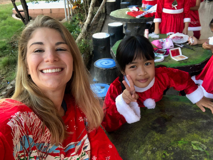 English teacher building connections with local students while teaching abroad