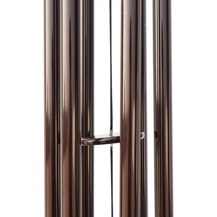 Brown metal wind chime on a white background