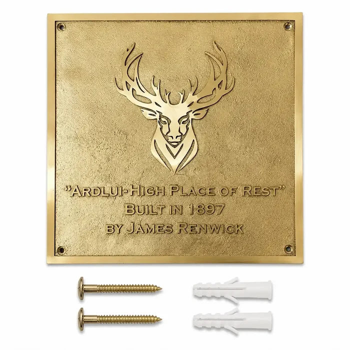 Personalized metal house plaque displayed with included screws and wall anchors on a clean white background.