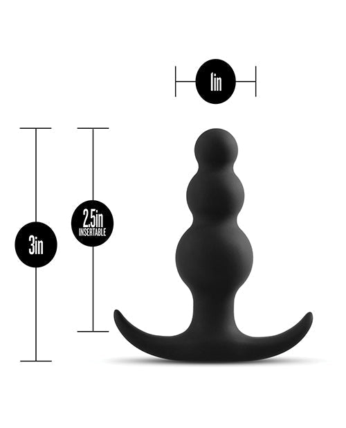 Black silicone butt plug with measurements on a white background