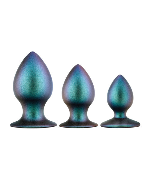 Three metallic teal and purple butt plugs of different sizes on a white background