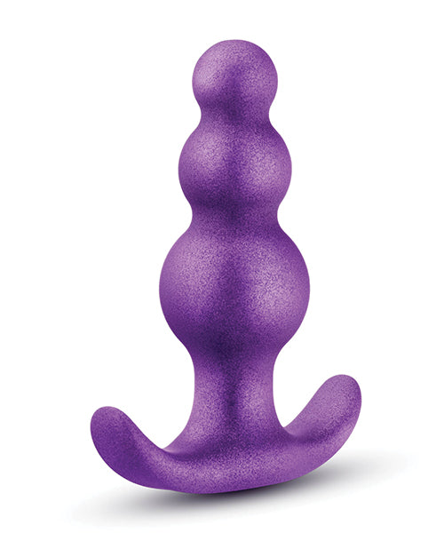 Purple KONG dog toy on a white background