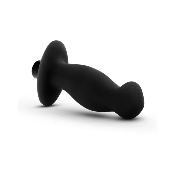 Black silicone butt plug on a white background