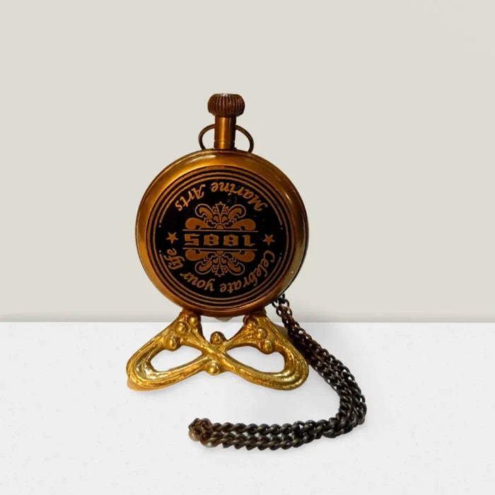 Backside Close-up of engraved antique brass pocket watch