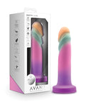 Silicone product with gradient color design next to its packaging on a white background