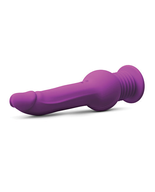 Purple silicone butt plug on a white background