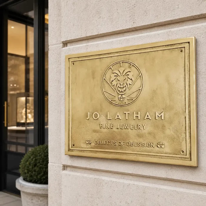 Custom brass wall plaque with engraved address information