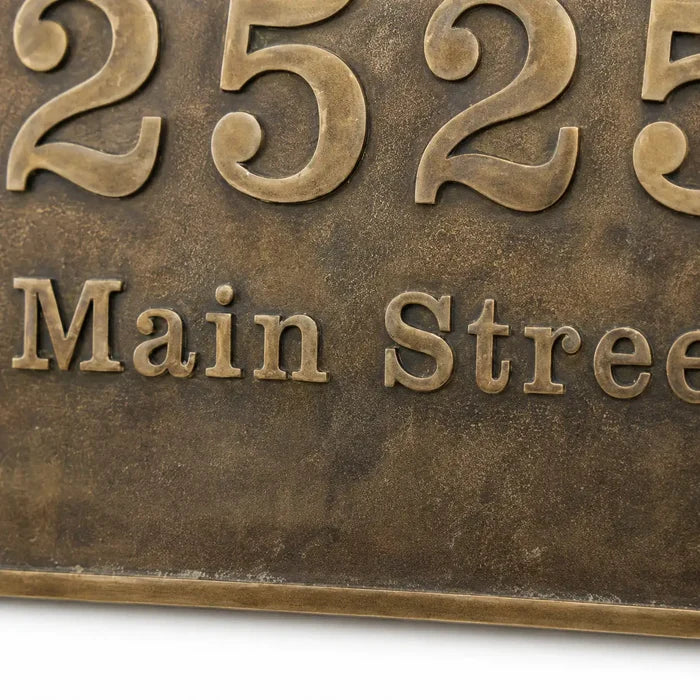Brass oval house number plaque with precision engraved lettering