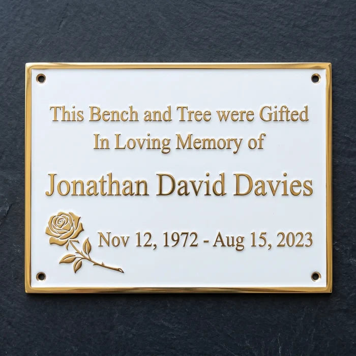 Memorial plaque with engraved text on a dark background