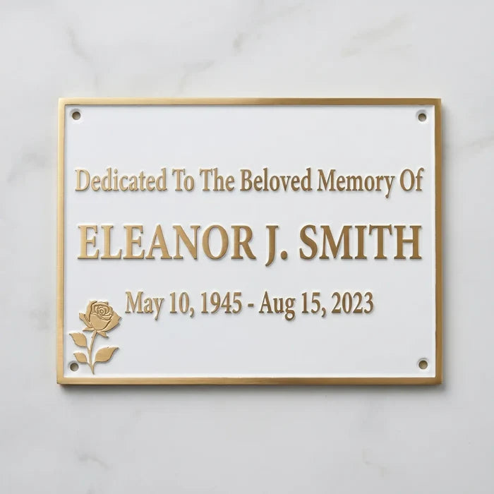 Memorial plaque dedicated to Eleanor J. Smith with a rose design on a white background