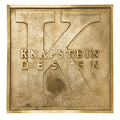 A rectangular engraved brass nameplate with the custom engraved text.