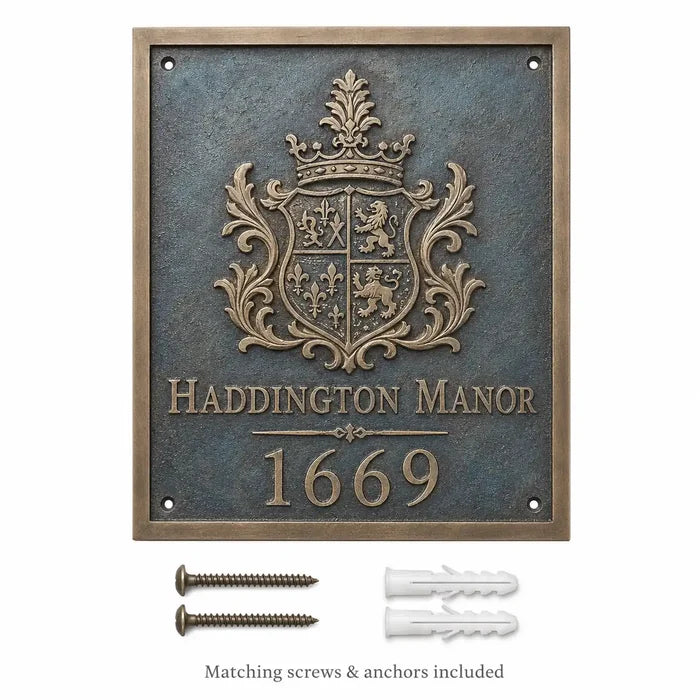 Custom bronze house number plaque displayed with mounting hardware, including two screws and two wall plugs.