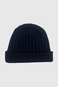 Cashmere Beanie in navy with a ribbed texture, perfect for adding warmth and style to any outfit.