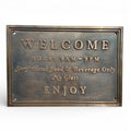 Bronze address plaque - Bronze welcome sign with text on a white background