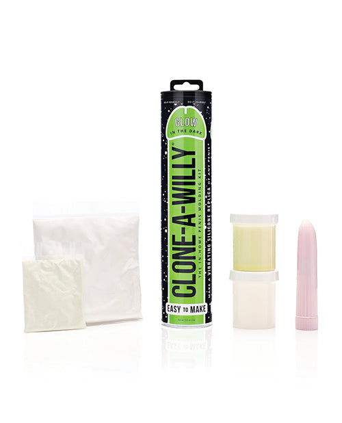 Clone-A-Willy product set with packaging, waxy substance, and pink tool on a white background