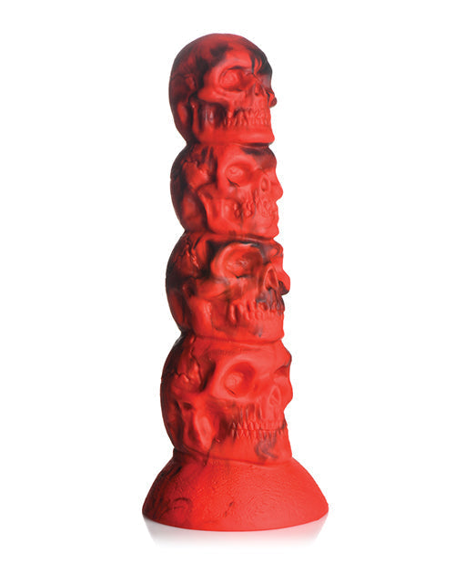 Red silicone butt plug with skull design on a white background