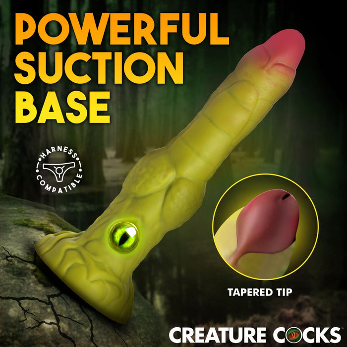 Sexual product with 'Powerful Suction Base' text and 'Creature Cocks' branding on a dark background.