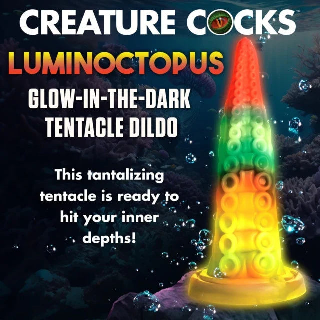 Glow-in-the-dark tentacle dildo with colorful design against an underwater-themed background.