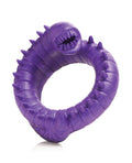 Purple rubber ring with spikes on a white background