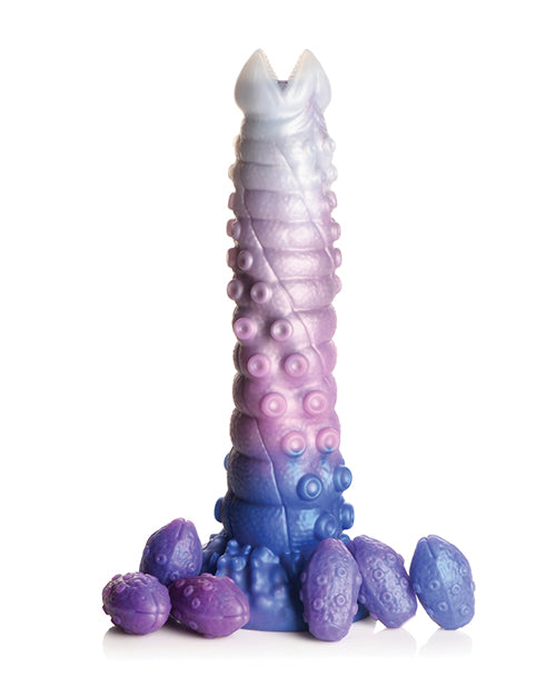 Purple and blue textured candle on a white background