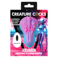 Vibrating silicone grinder packaging with alien design and 'Creature Cocks' branding.