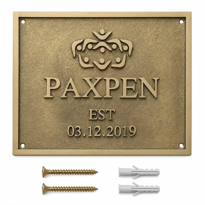 Custom brass address plaque with two mounting screws and two wall anchors arranged for easy wall installation.
