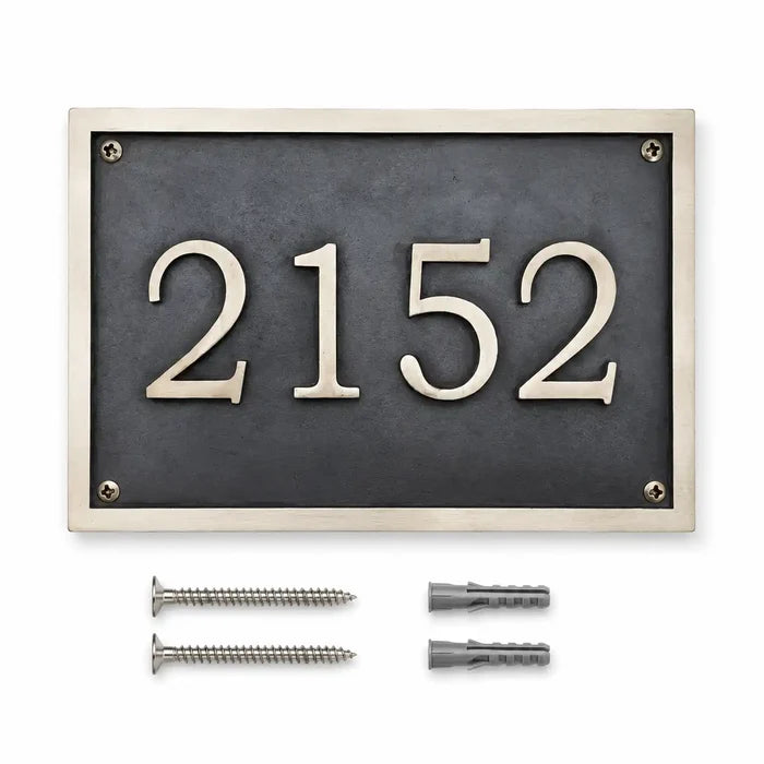 Custom brass address plaque displayed with two mounting screws and two wall anchors included for secure and easy installation.
