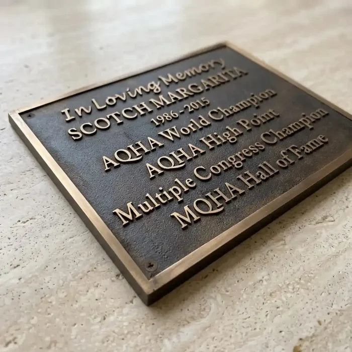 Cast bronze memorial plaque with raised lettering and custom inscription