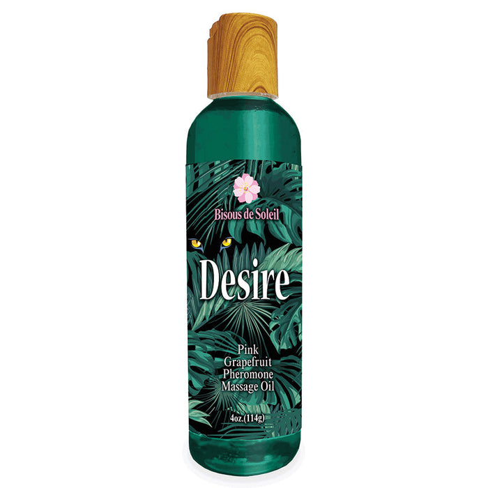 Bottle of Bisous de Soleil Desire Pink Grapefruit Pheromone Massage Oil with tropical leaf design on a white background