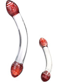 Two glass objects with red and white striped ends on a white background