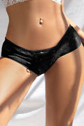 Black lace underwear on a neutral background