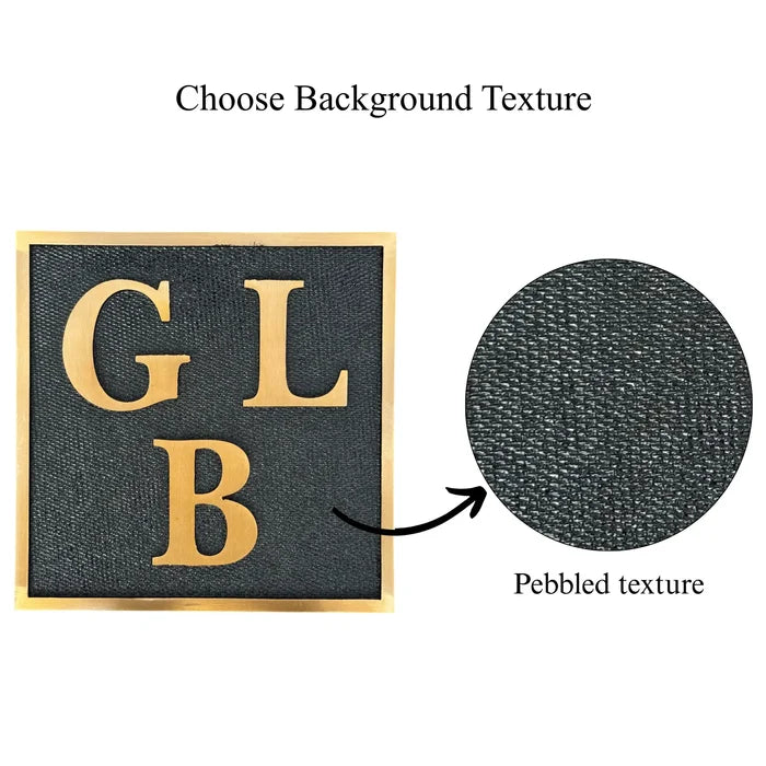 Custom brass address plaque on a pebbled texture background