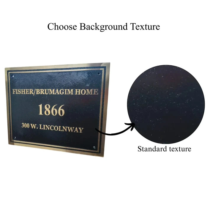 Engraved brass address plaque with a neutral textured backdrop