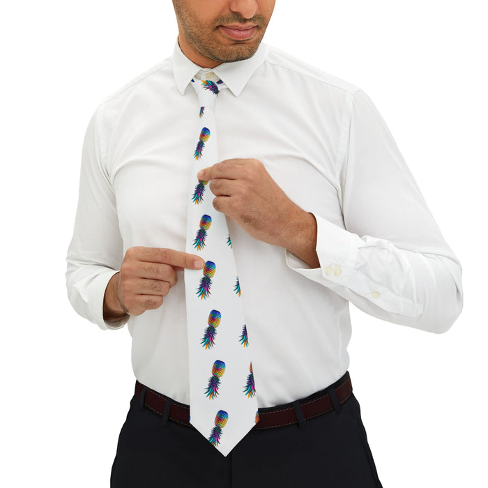 A man wearing a white shirt and a necktie with a colorful upside down pineapple design.