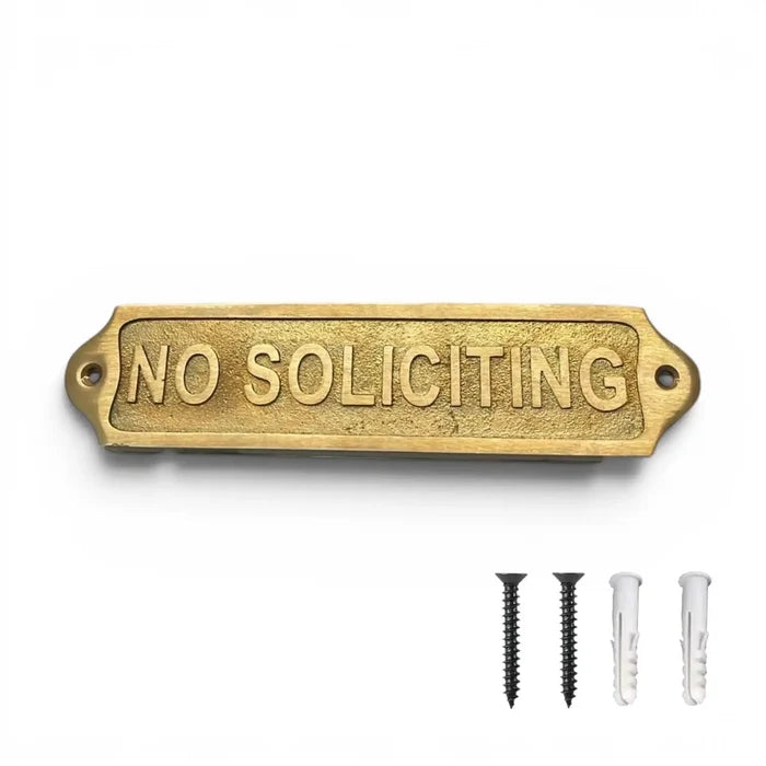 Brass 'No Soliciting' sign with mounting hardware on a white background