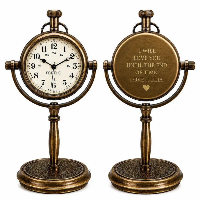 Two antique-style bronze desk clocks on a white background, one showing the front with a white dial and black numerals, and the other showing the back with a personalized inscription.