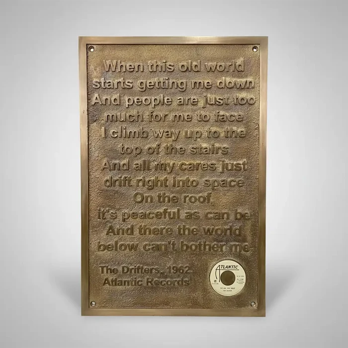 personalized bronze plaque engraved lyrics and Atlantic Records logo on a gray background