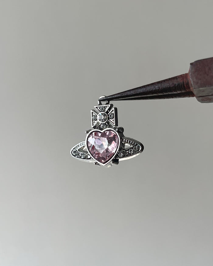 Pink saturn heart charm
