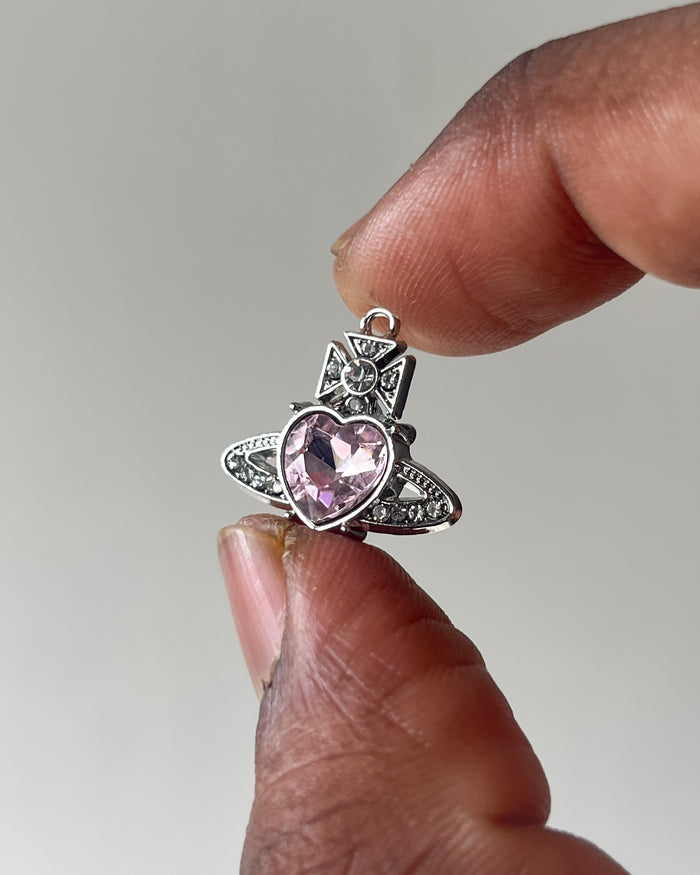 Pink saturn heart charm