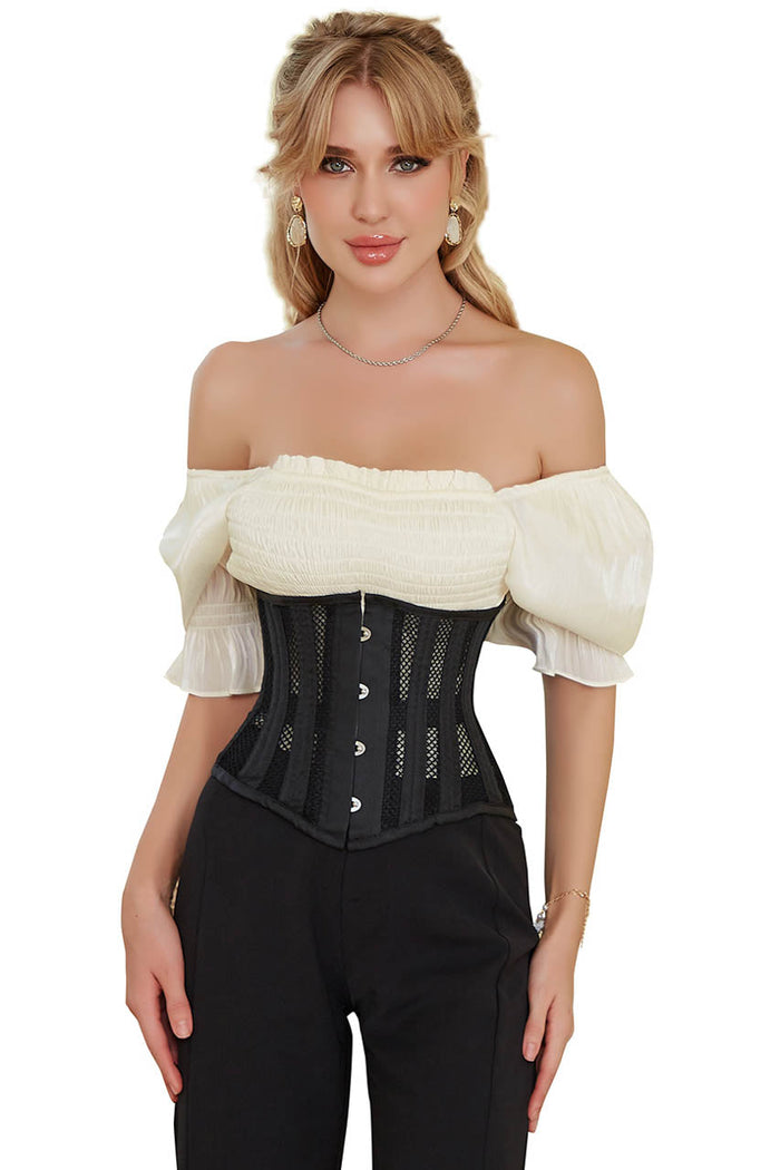 Woman wearing a black corset over a white off-shoulder top on a white background