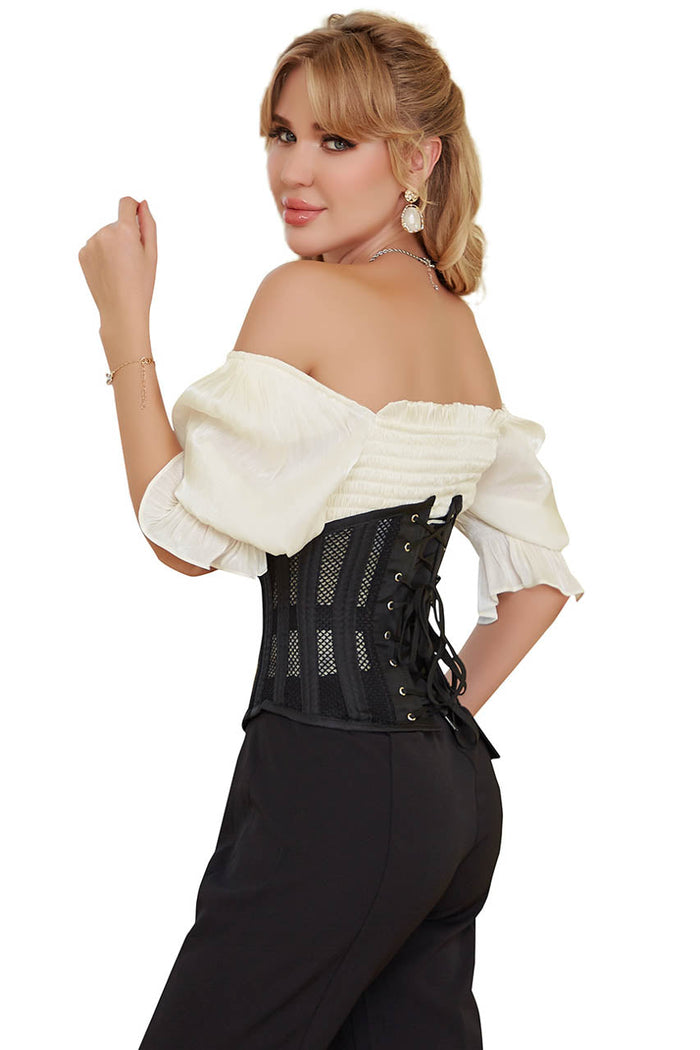 Woman wearing a black corset with a white off-shoulder top on a white background