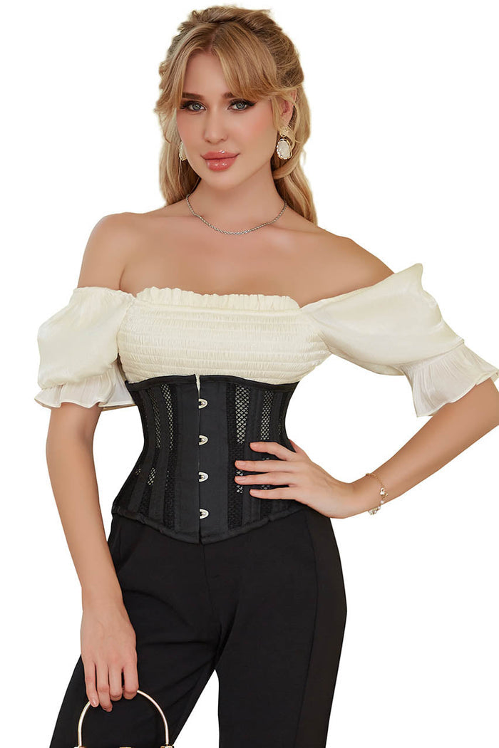 Woman wearing a black corset with a white off-shoulder top on a white background