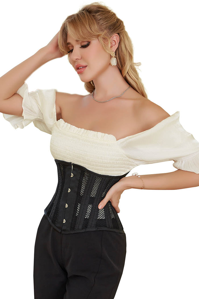 Woman wearing a black corset with a white off-shoulder top on a white background