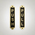 Two door signs labeled 'Push' and 'Pull' on a light gray background