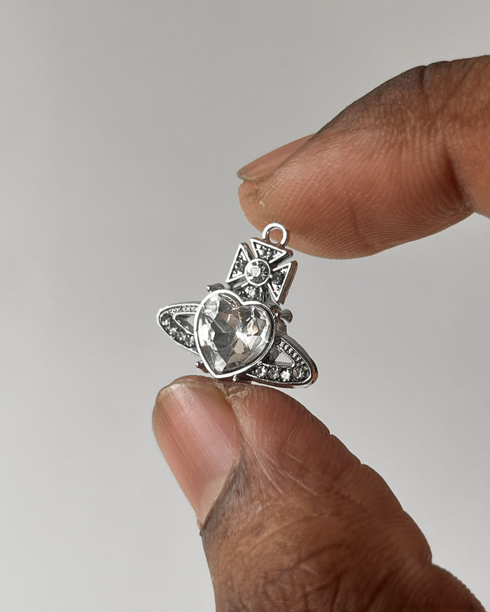 White saturn heart charm