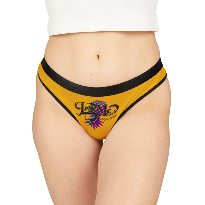 Yellow underwear with black waistband featuring a logo on a white background